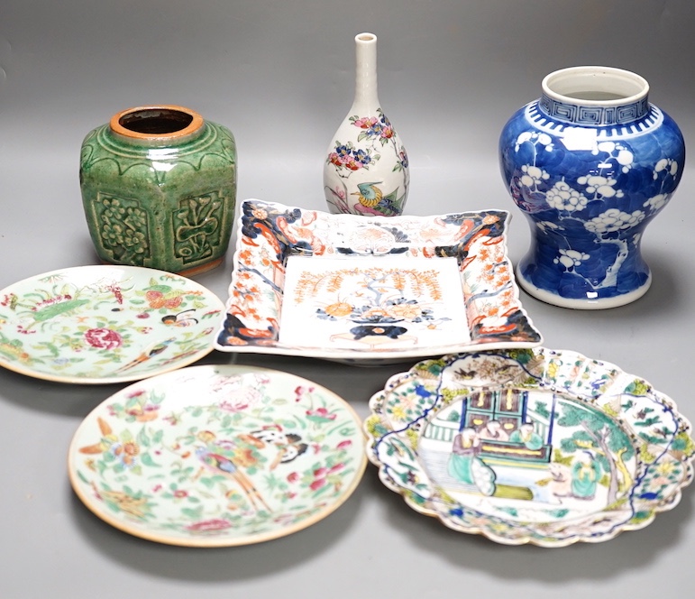 A 19th century Chinese blue and white 'prunus' vase, a Chinese green glazed jar, a japanese vase and two dishes and two Canton famille rose plates (7)